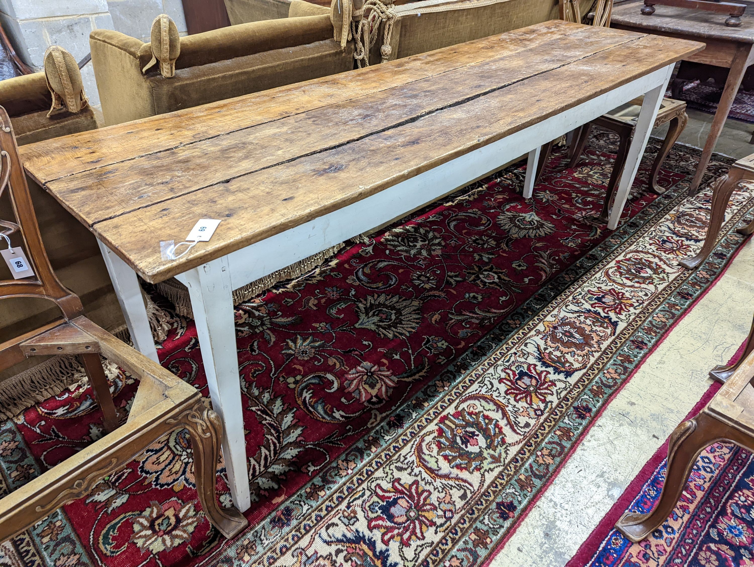 A 19th century French rectangular part painted fruitwood kitchen table. Length -214cm, Depth- 62cm, Height-76cm.